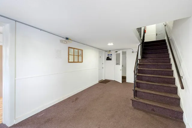 a view of a hallway with white walls
