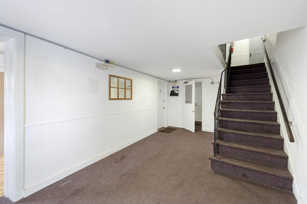 50 East Main Street Orange, MA 01364 - Photo 15 of 23 a view of an empty room with stairs