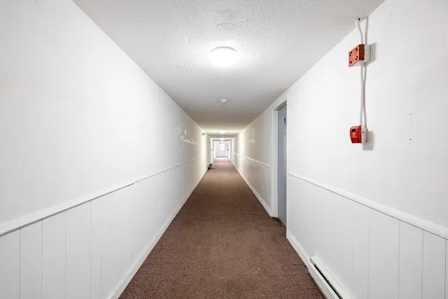 a kitchen with granite countertop cabinets appliances and a sink