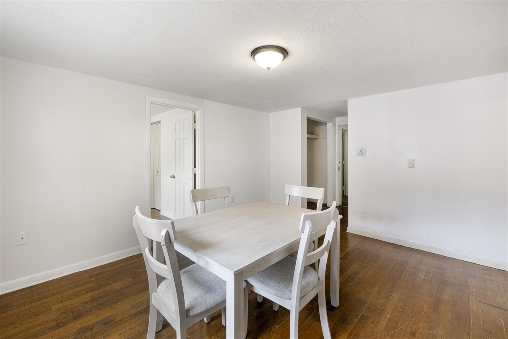 50 East Main Street Orange, MA 01364 - Photo 20 of 23 a view of a dining room with furniture and wooden floor