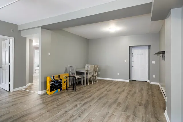 a view of a livingroom with furniture and wooden floor