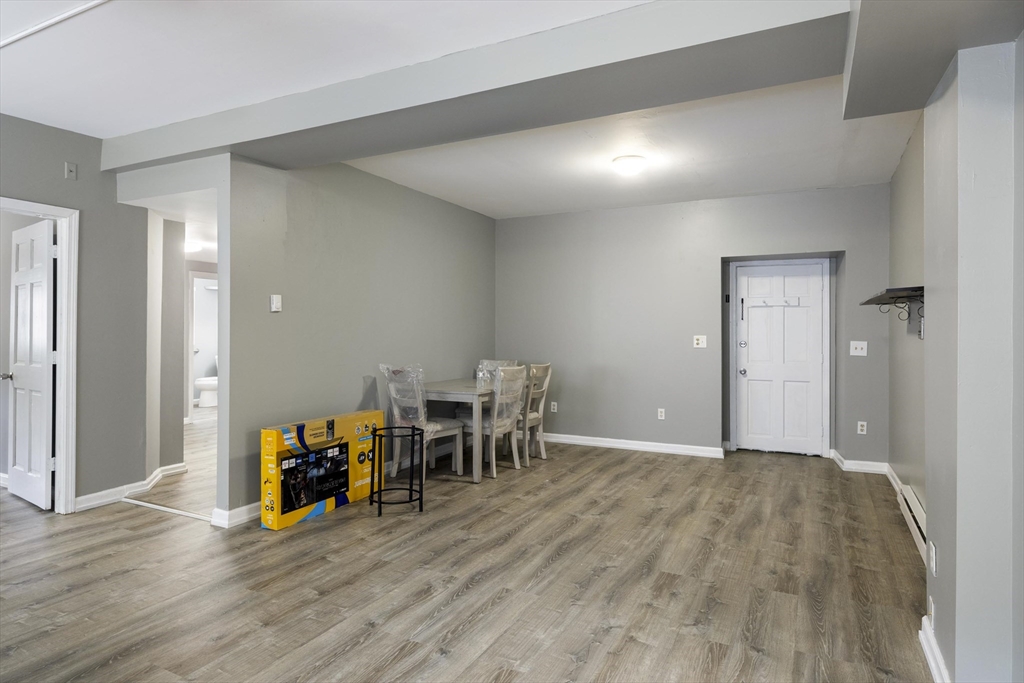 50 East Main Street Orange, MA 01364 - Photo 7 of 23 a view of a livingroom with furniture and wooden floor