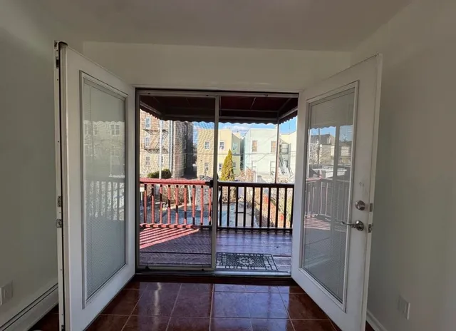 a view of a porch with wooden floor