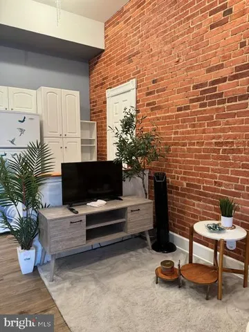 a outdoor living space with furniture and a potted plant