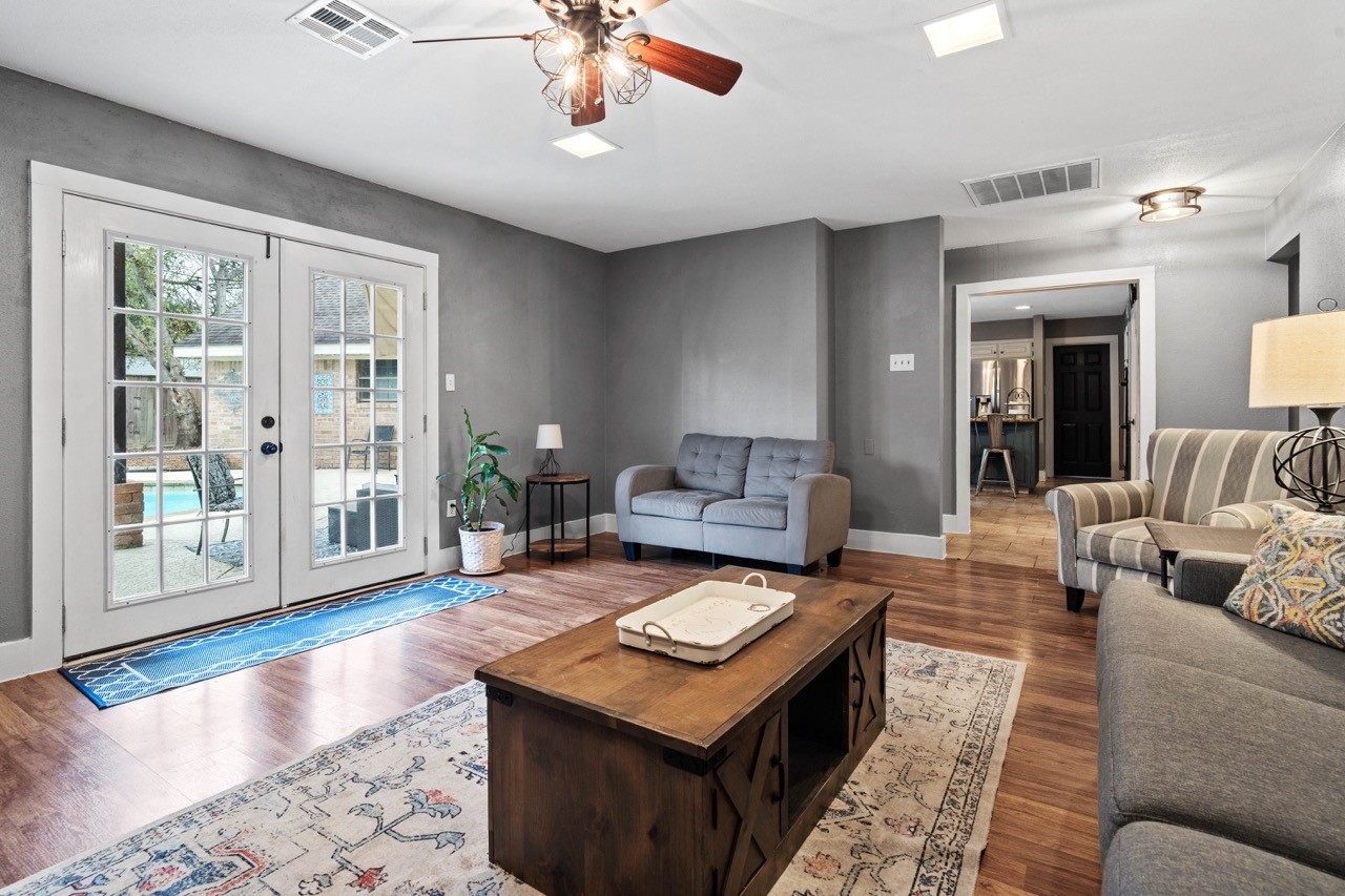 1102 Sherfield Ridge Drive Katy, TX 77450 - Photo 14 of 39 a living room with furniture and a wooden floor
