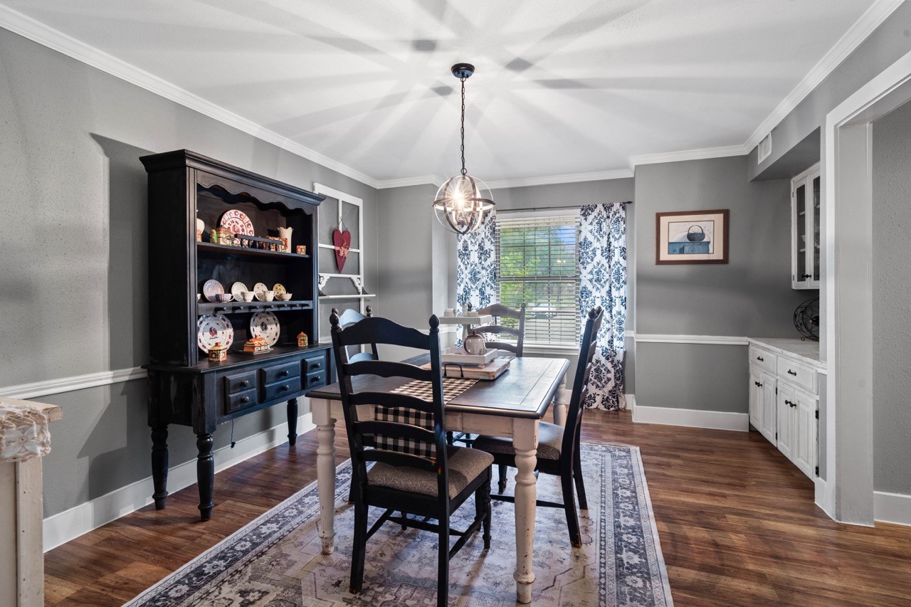 1102 Sherfield Ridge Drive Katy, TX 77450 - Photo 10 of 39 a dining room with furniture a chandelier and wooden floor