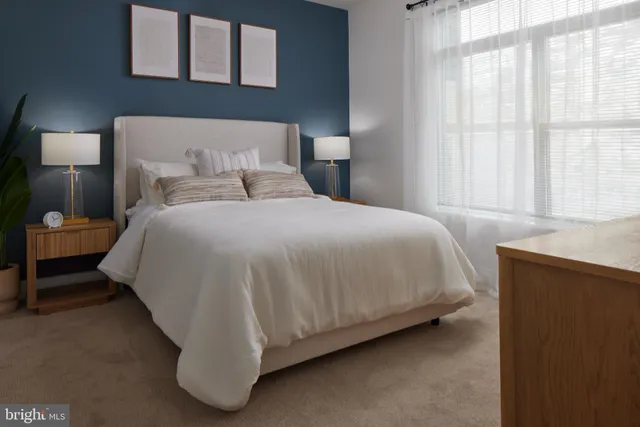 a bathroom with a toilet a sink and a mirror