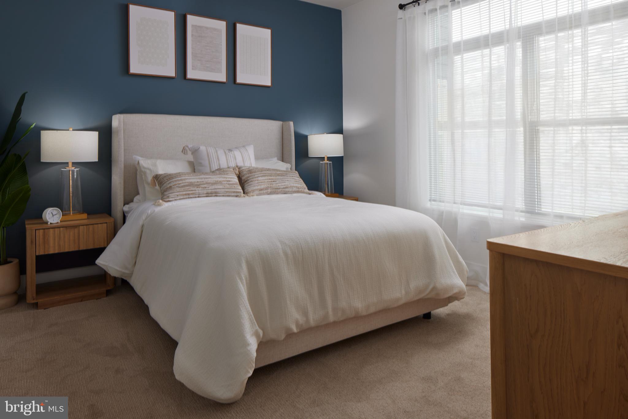 300 Furnace Street, Unit 103 Emmaus, PA 18049 - Photo 3 of 6 a bedroom with a bed and window