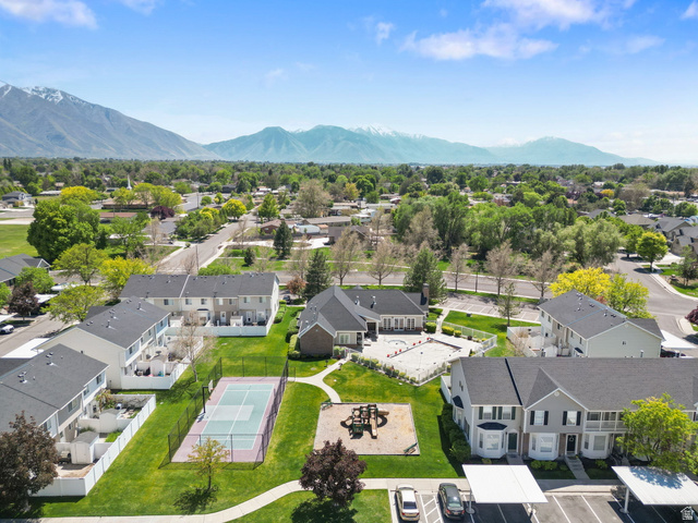 732 North 200 E Street Springville, UT 84663 - Photo 35 of 36 Aerial perspective showcasing a community with mature trees and mountain scenery
