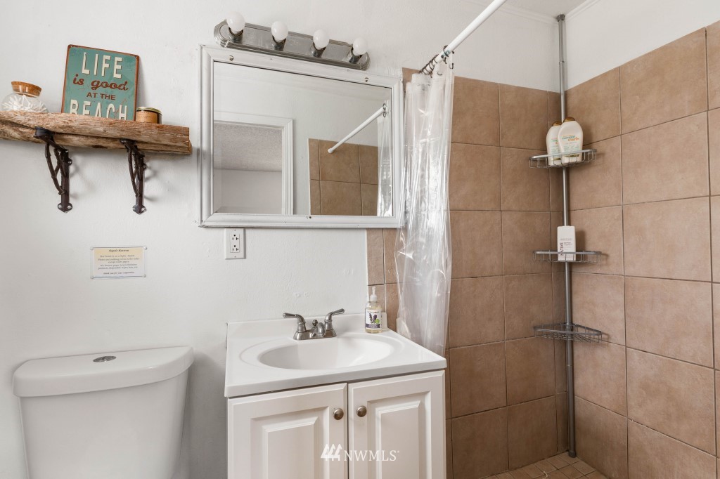 6582 Humphrey Road Clinton, WA 98236 - Photo 23 of 39 a bathroom with a sink a toilet and shower
