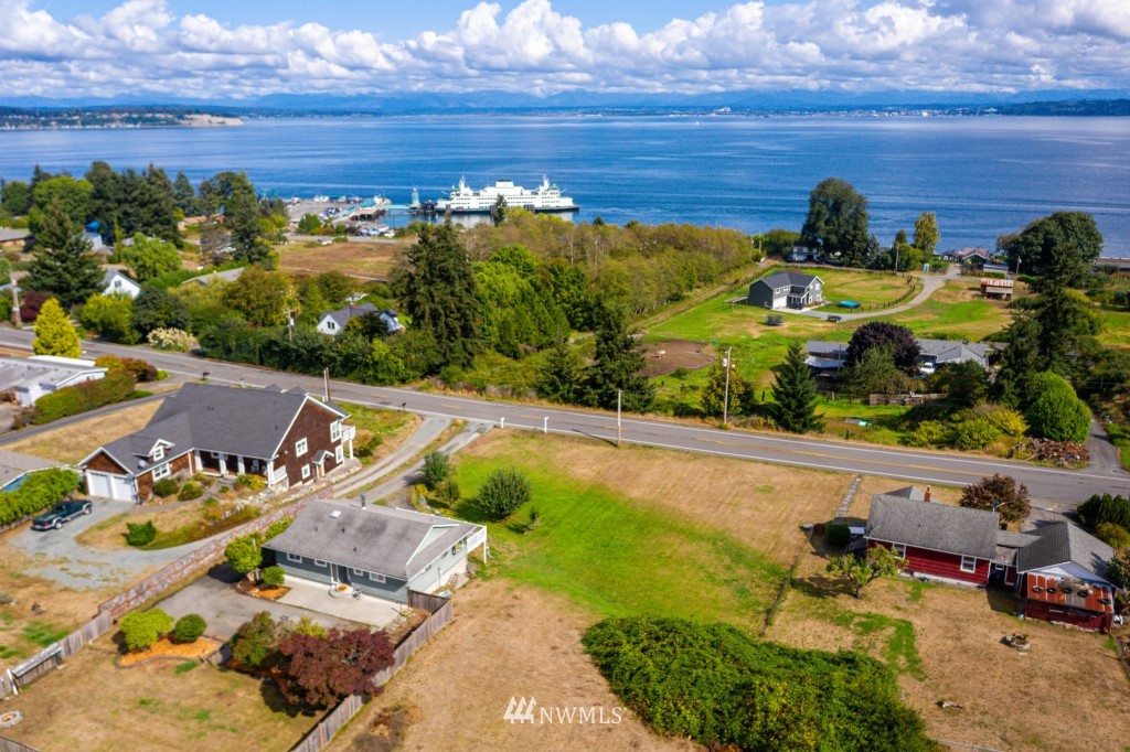 6582 Humphrey Road Clinton, WA 98236 - Photo 34 of 39 a view of a swimming pool with an outdoor seating