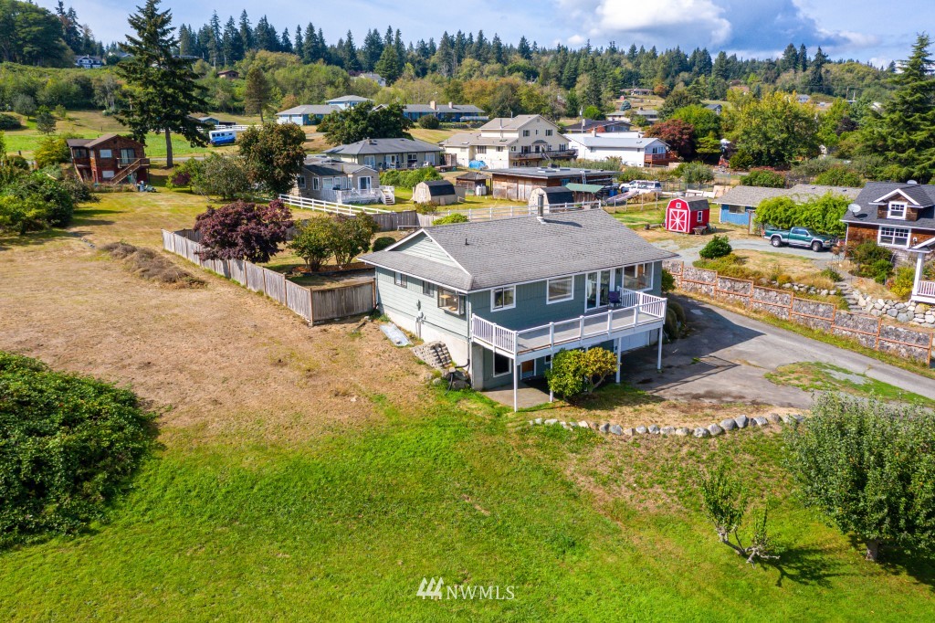 6582 Humphrey Road Clinton, WA 98236 - Photo 35 of 39 an aerial view of a house with yard swimming pool and outdoor seating