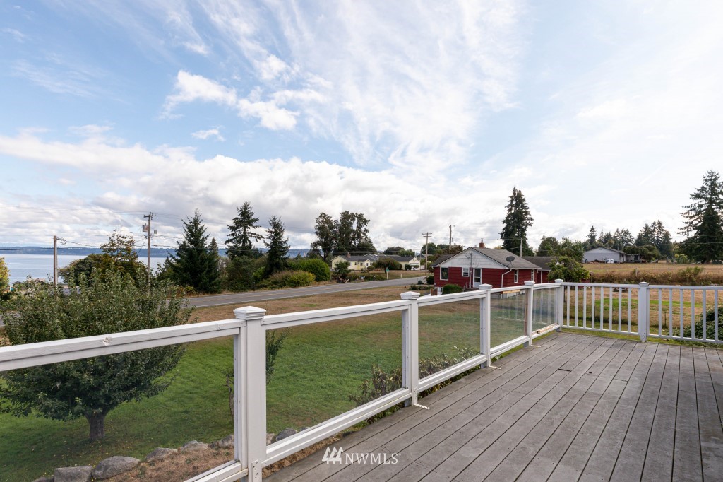 6582 Humphrey Road Clinton, WA 98236 - Photo 6 of 39 a view of a balcony with wooden floor
