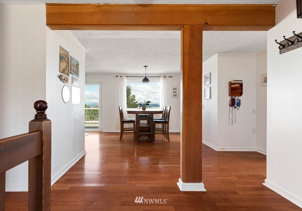 6582 Humphrey Road Clinton, WA 98236 - Photo 7 of 39 a view of living room with furniture and wooden floor