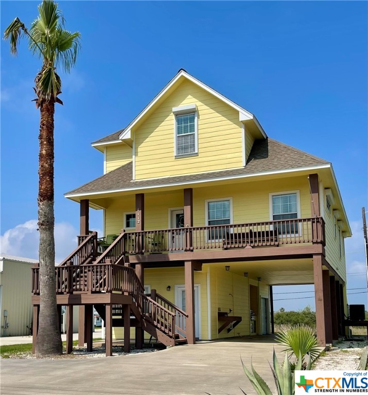 a front view of a house with glass top windows