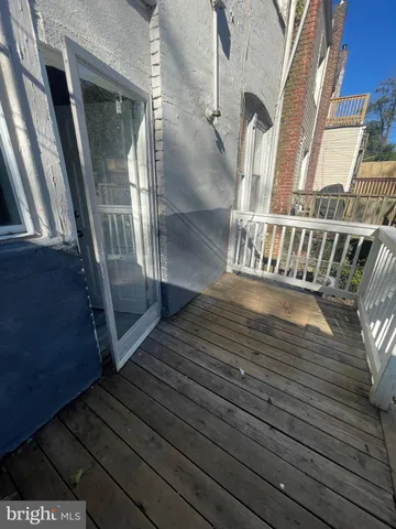 a view of balcony with wooden floor