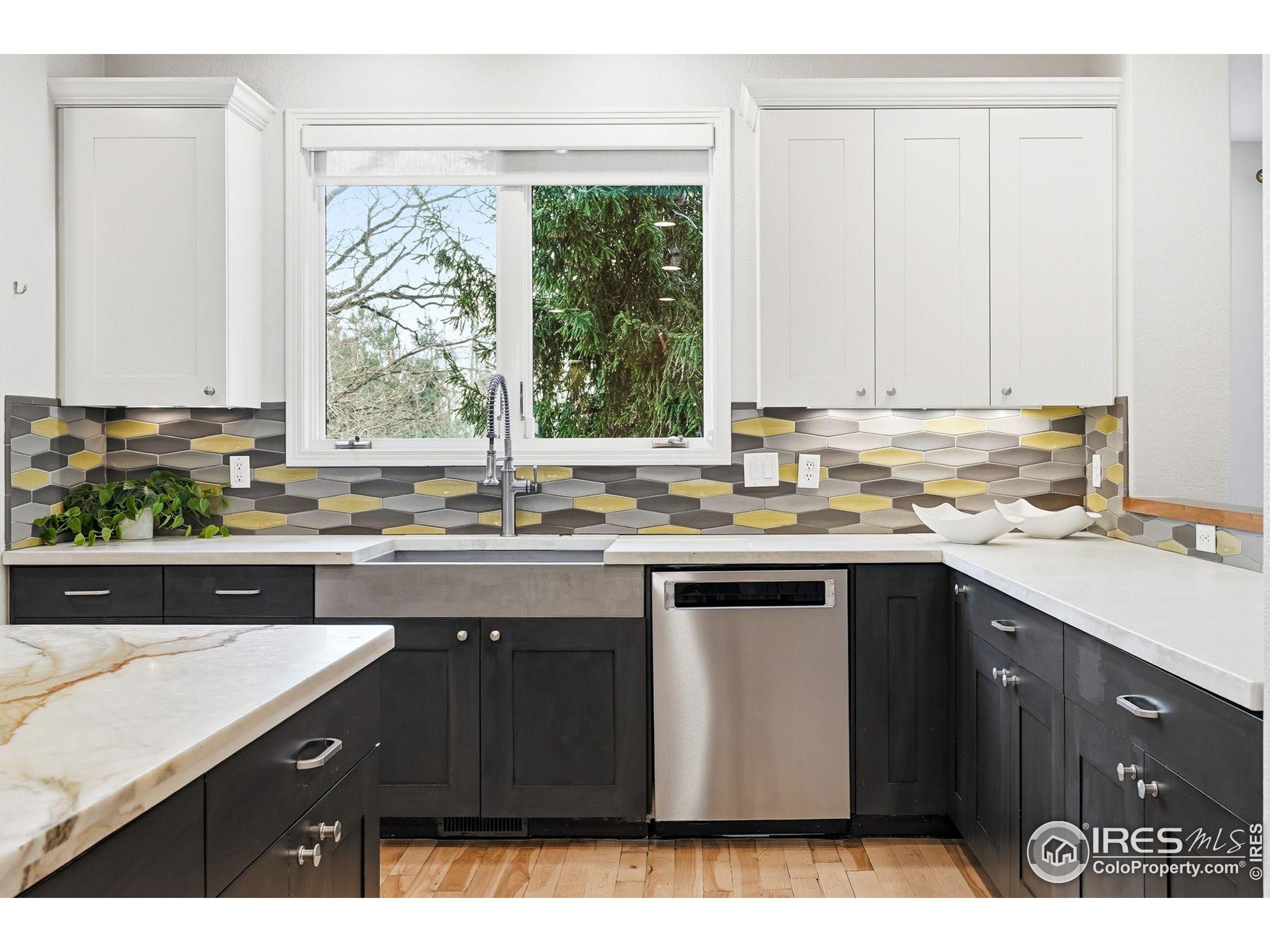 4840 6th Street Boulder, CO 80304 - Photo 12 of 48 a kitchen with a sink window and cabinets