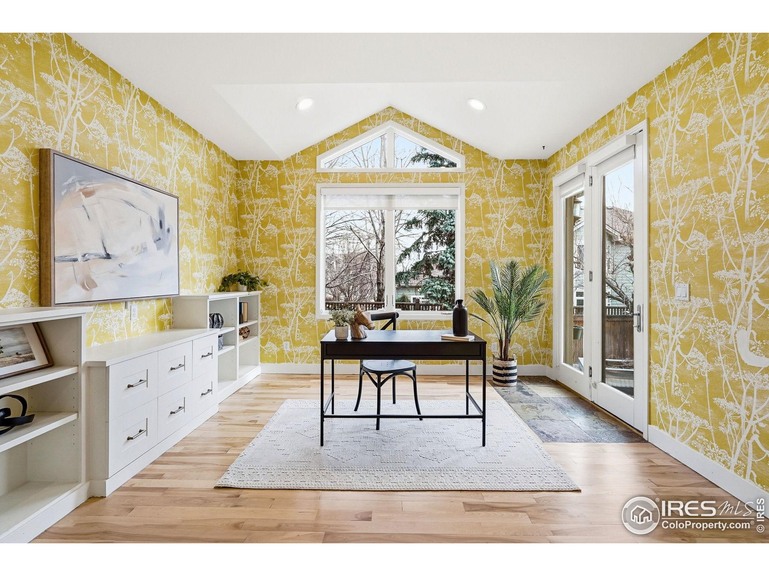 4840 6th Street Boulder, CO 80304 - Photo 13 of 48 a living room with furniture a large window and wooden floor