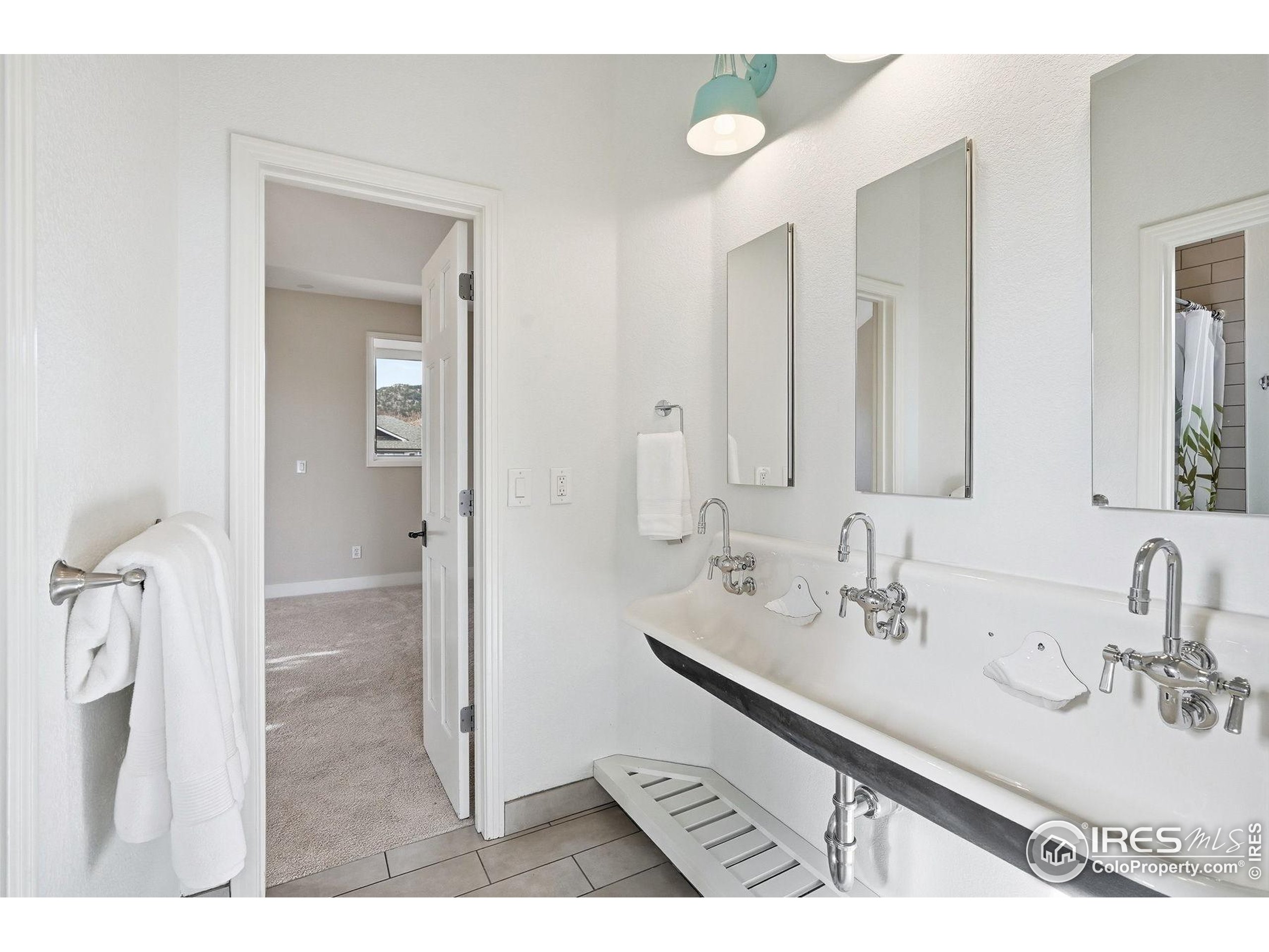 4840 6th Street Boulder, CO 80304 - Photo 30 of 48 a bathroom with a sink and a mirror
