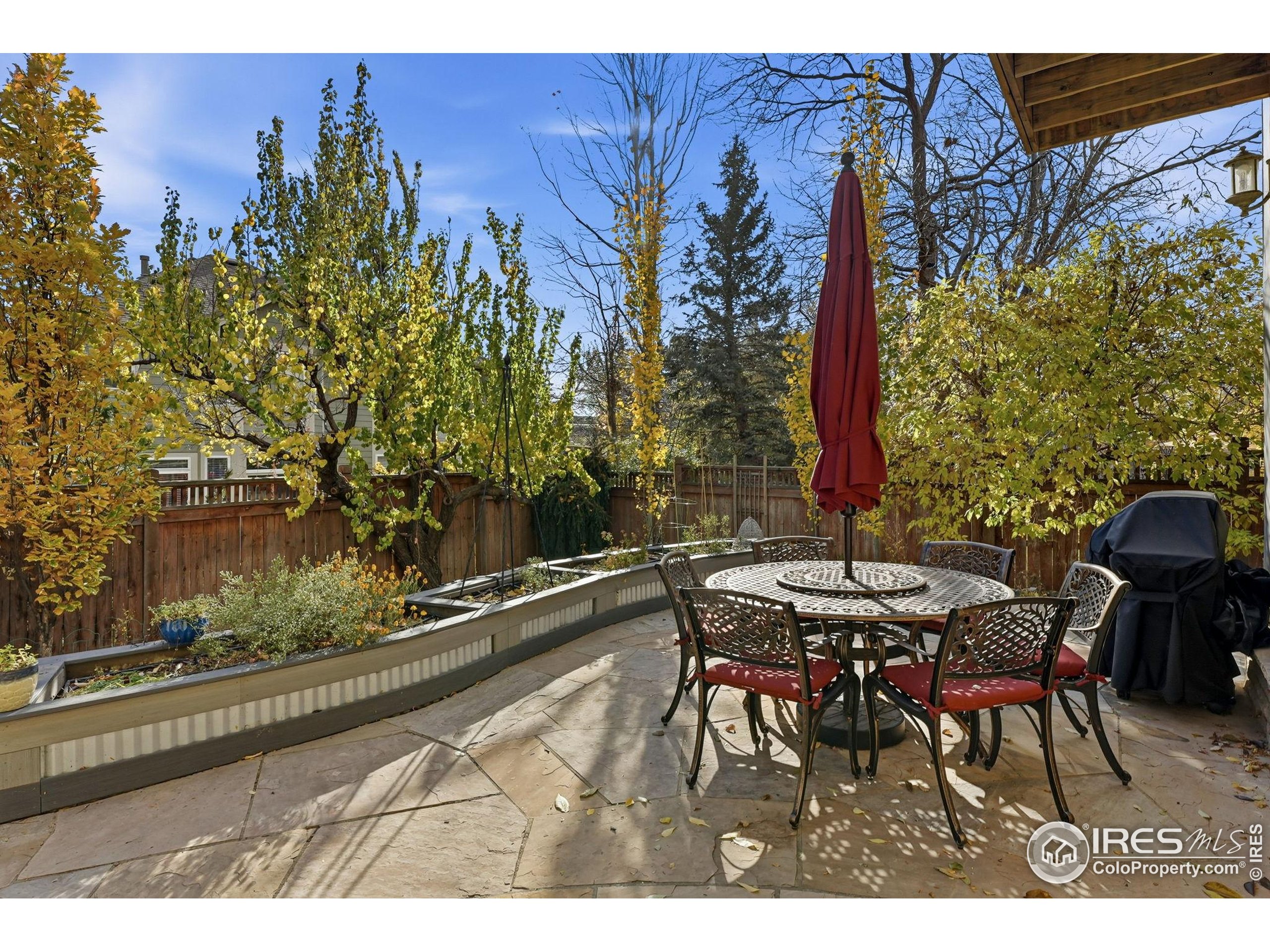 4840 6th Street Boulder, CO 80304 - Photo 40 of 48 a view of a patio with table and chairs and potted plants