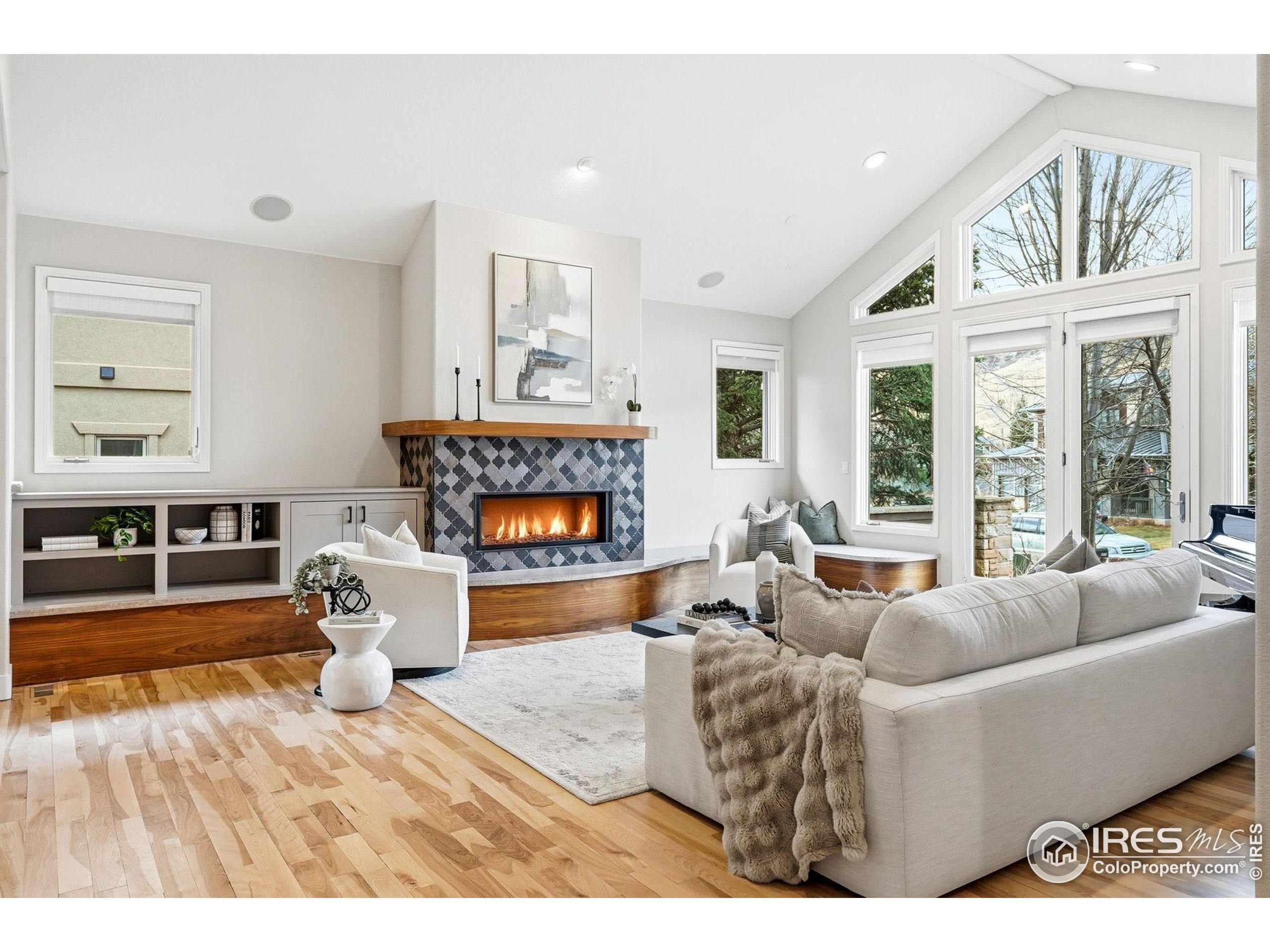 4840 6th Street Boulder, CO 80304 - Photo 4 of 48 a living room with furniture a fireplace and a large window