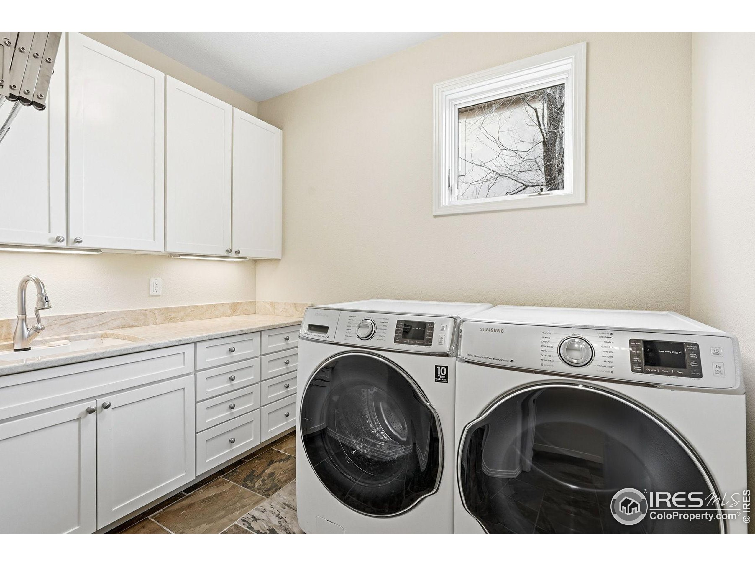 4840 6th Street Boulder, CO 80304 - Photo 46 of 48 a utility room with sink dryer and washer
