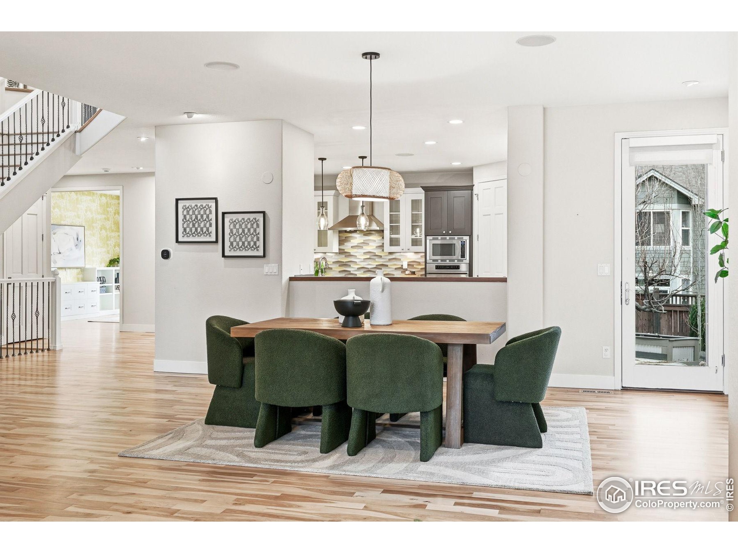 4840 6th Street Boulder, CO 80304 - Photo 8 of 48 a view of a dining room with furniture window and wooden floor
