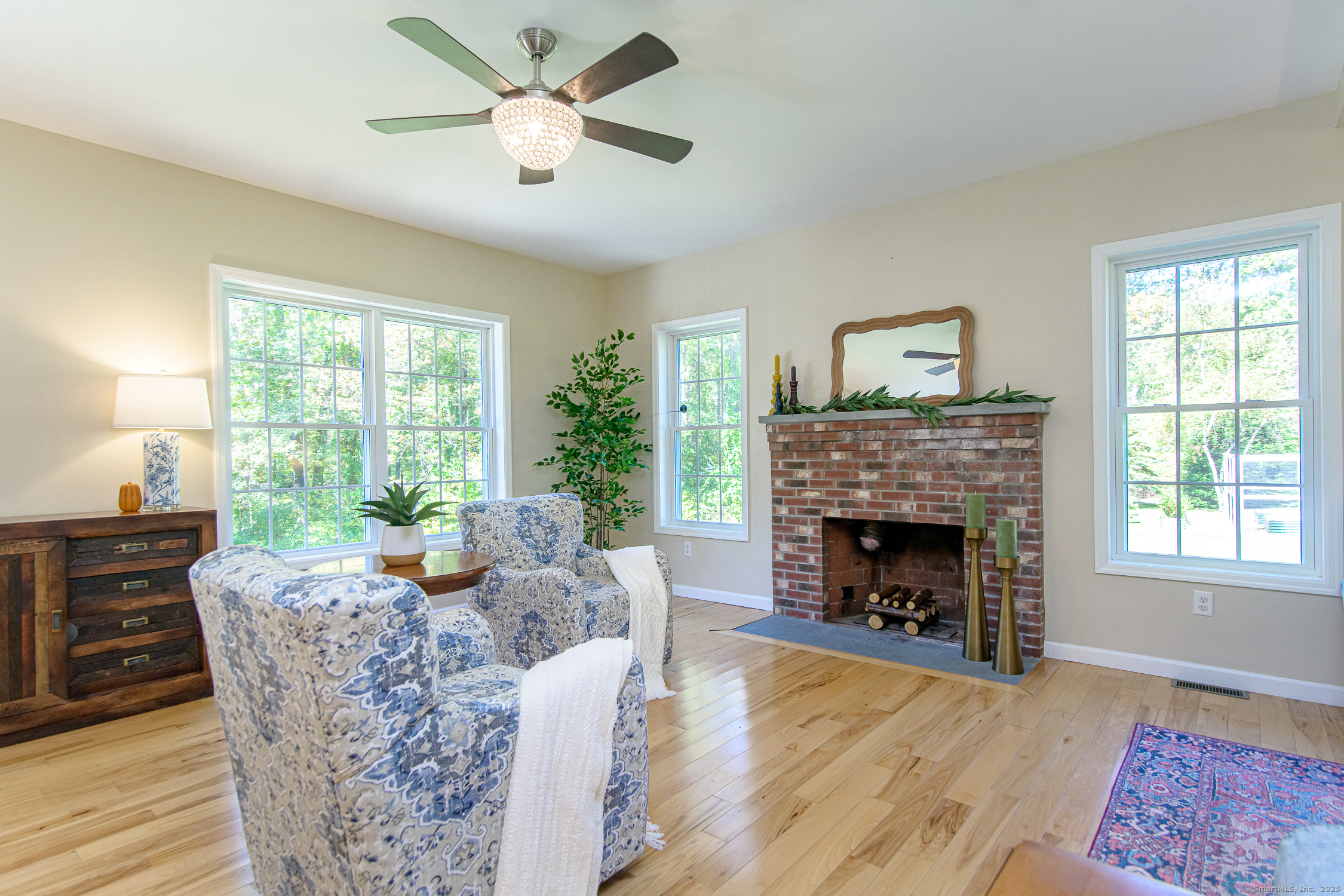 189 Center Road Woodstock, CT 06281 - Photo 13 of 40 a living room with furniture a window and a fireplace
