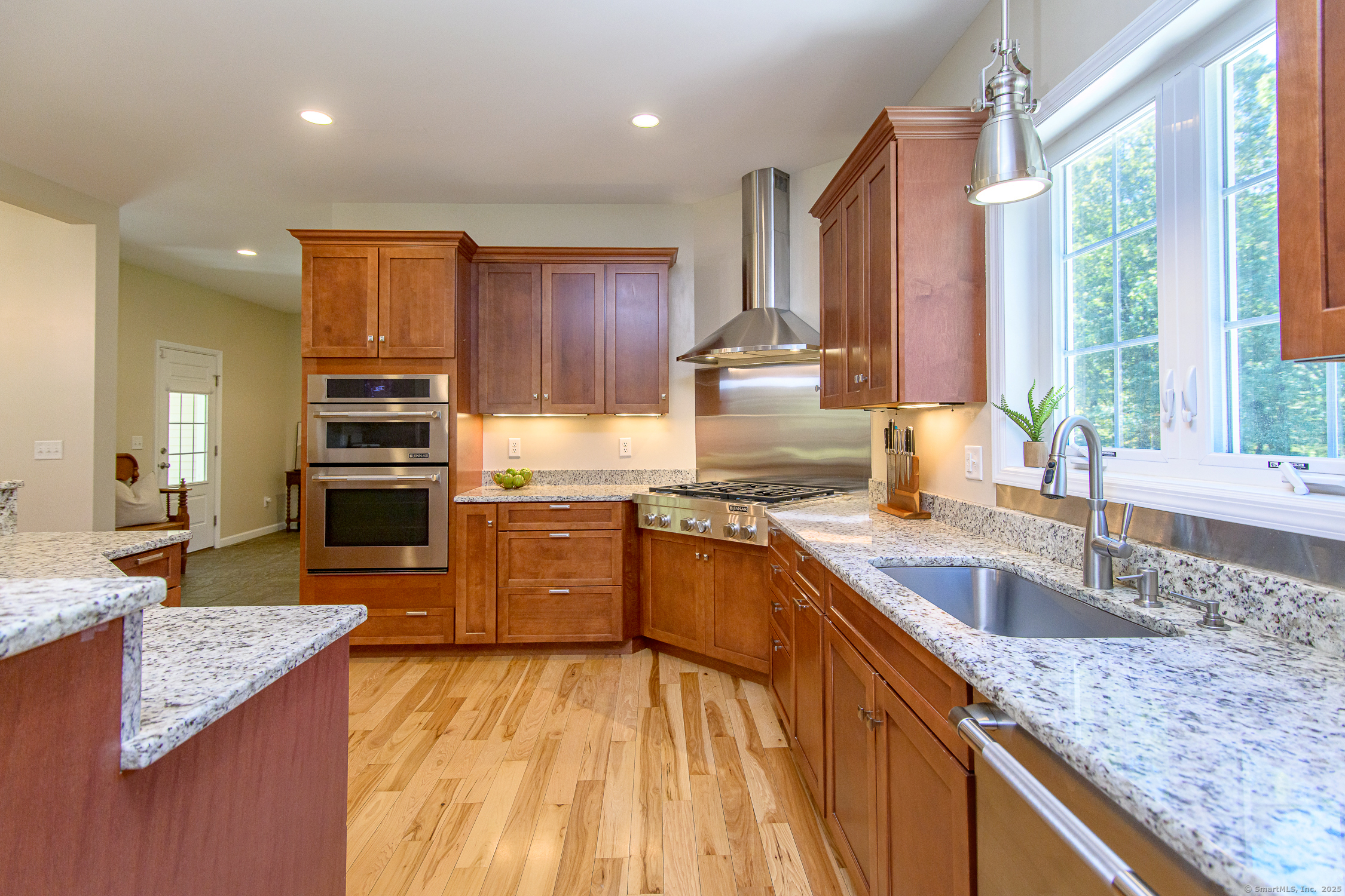 189 Center Road Woodstock, CT 06281 - Photo 16 of 40 a kitchen with stainless steel appliances granite countertop a sink stove and refrigerator