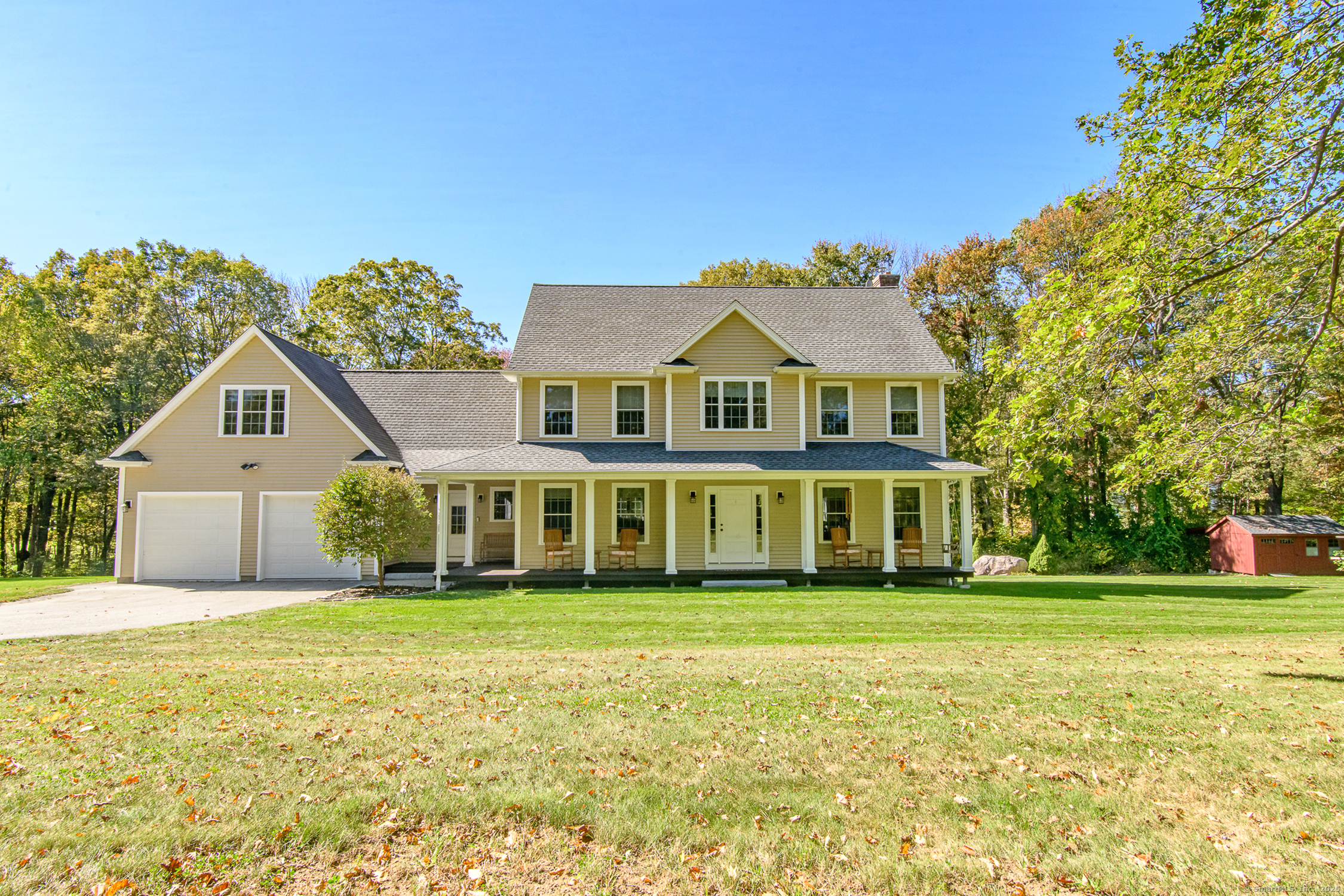 189 Center Road Woodstock, CT 06281 - Photo 2 of 40 a front view of a house with a garden