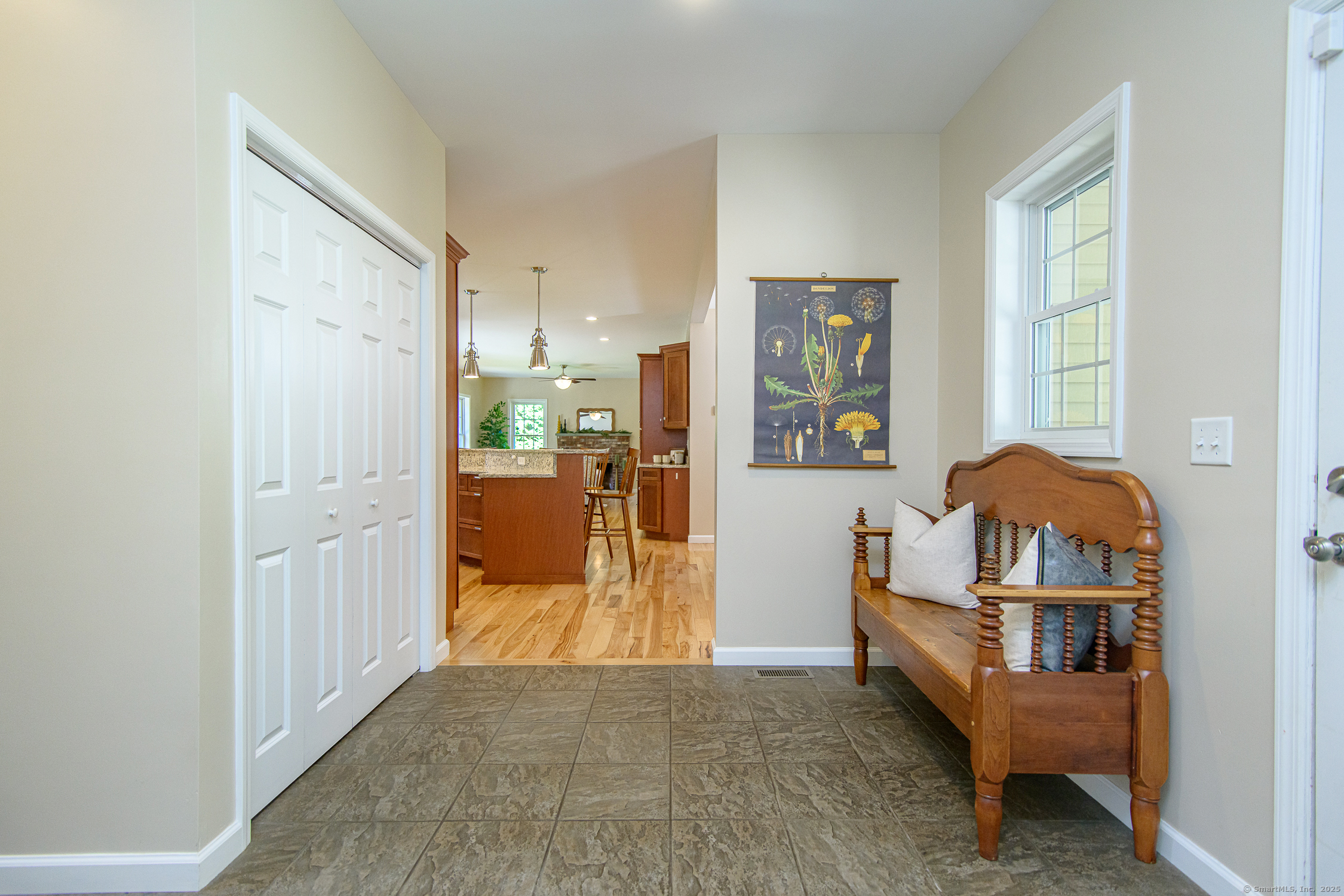 189 Center Road Woodstock, CT 06281 - Photo 24 of 40 a living room with furniture and a baby crib