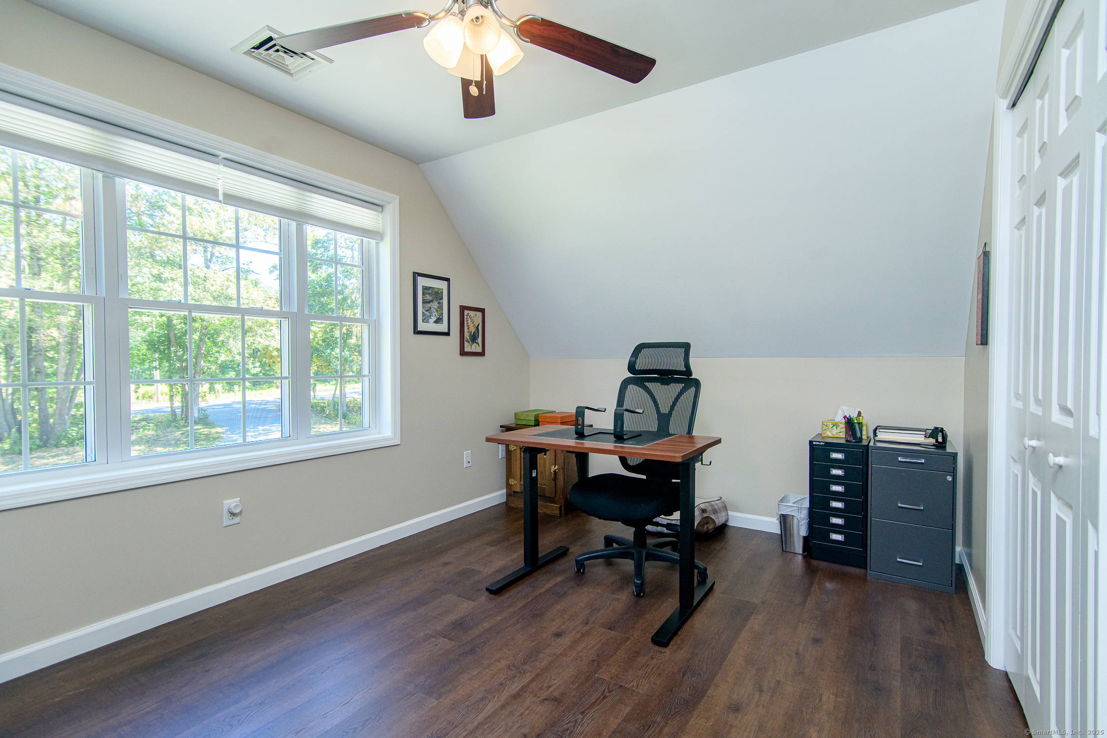 189 Center Road Woodstock, CT 06281 - Photo 28 of 40 a view of a workspace with furniture and a window