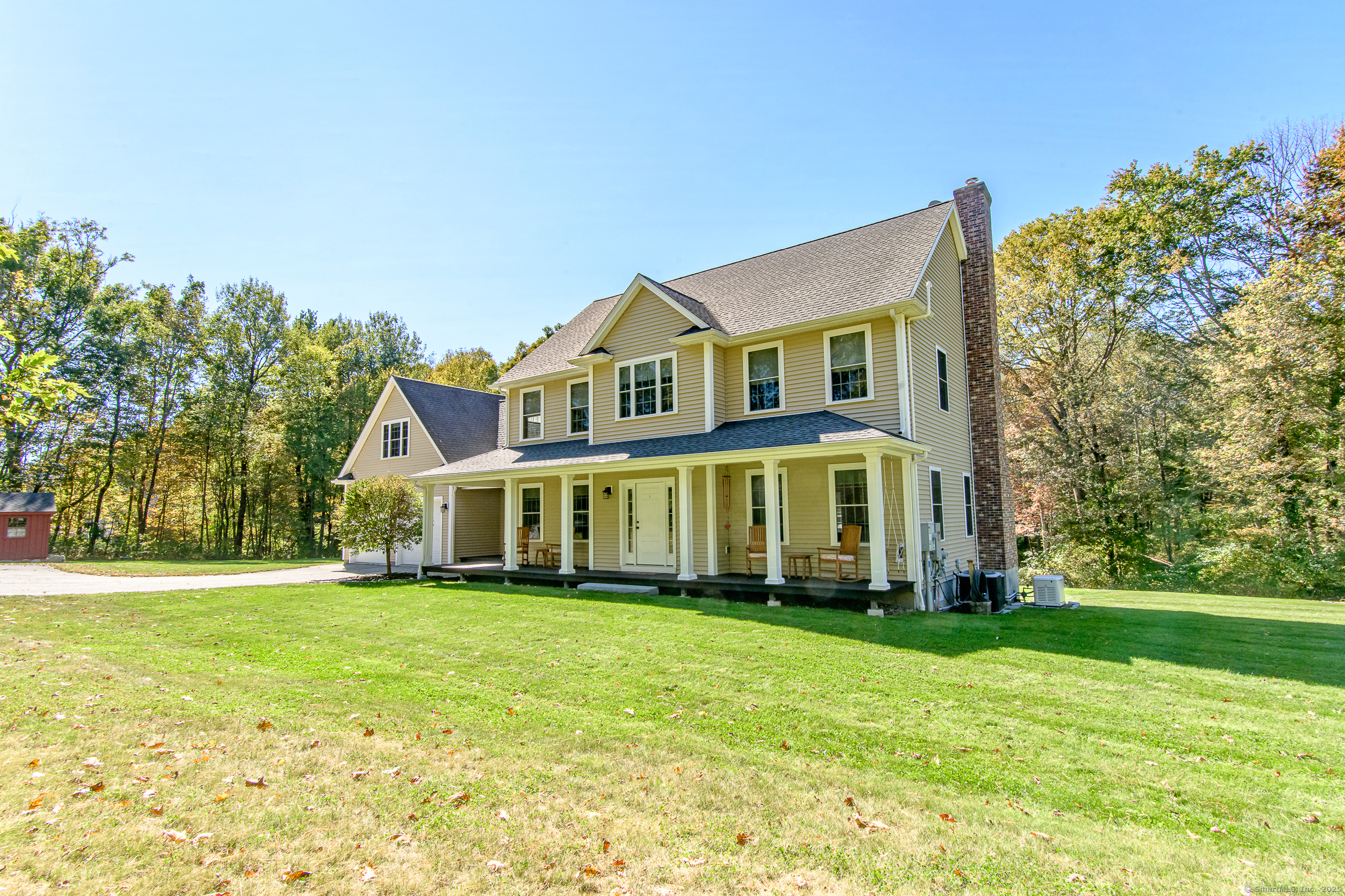 189 Center Road Woodstock, CT 06281 - Photo 3 of 40 a front view of a house with a garden