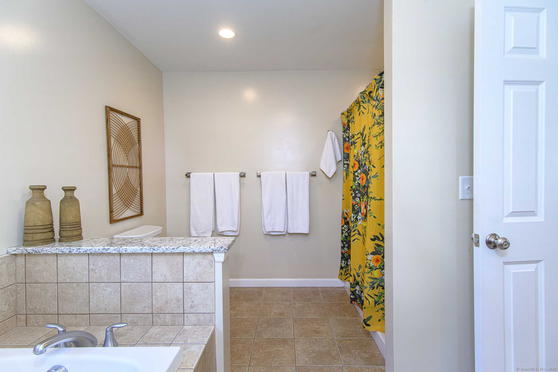 189 Center Road Woodstock, CT 06281 - Photo 34 of 40 a bathroom with a granite countertop shower a sink and a mirror
