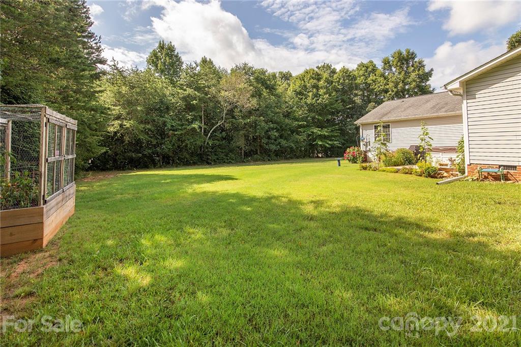 5019 King Wilkinson Road Denver, NC 28037 - Photo 22 of 27 a view of a house with backyard and sitting area