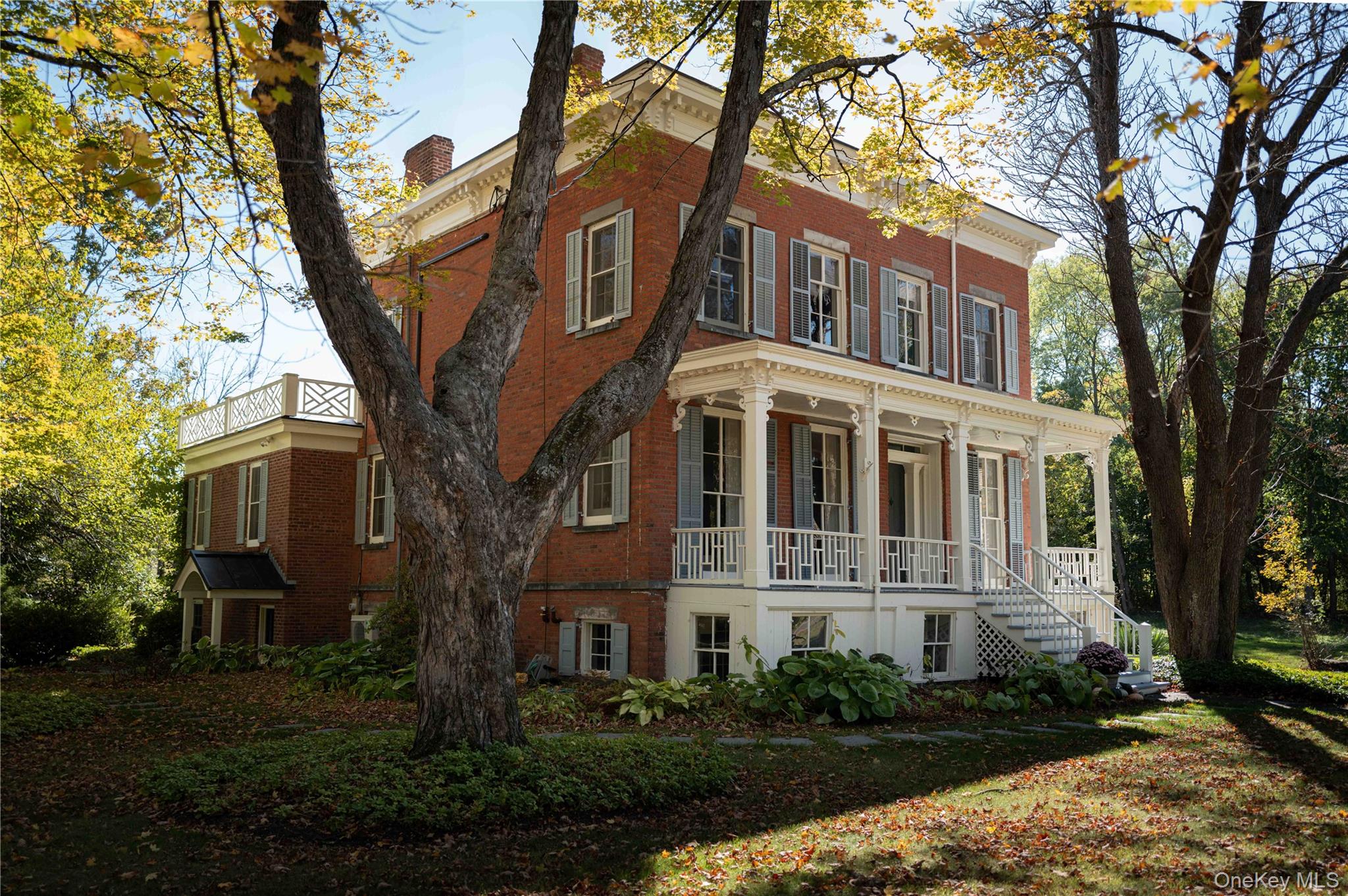 1281 Woods Road Germantown, NY 12526 - Photo 1 of 33 a front view of a house with garden and trees