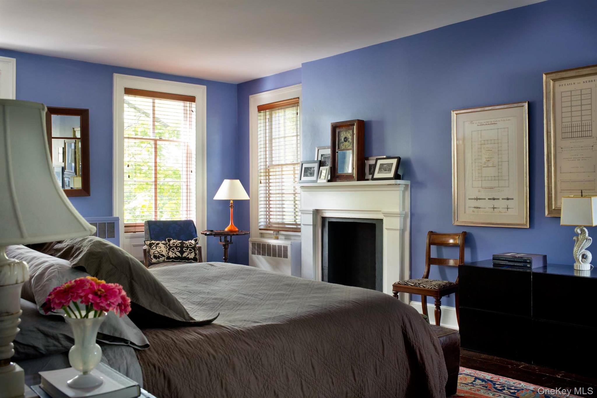 1281 Woods Road Germantown, NY 12526 - Photo 19 of 33 a spacious bedroom with a bed and a fireplace