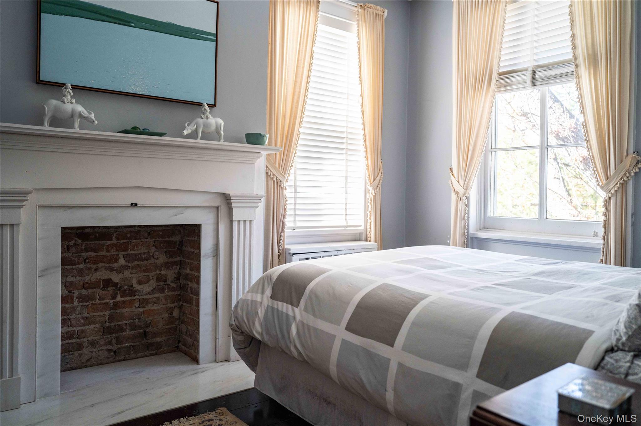 1281 Woods Road Germantown, NY 12526 - Photo 22 of 33 a bedroom with a bed and a fireplace