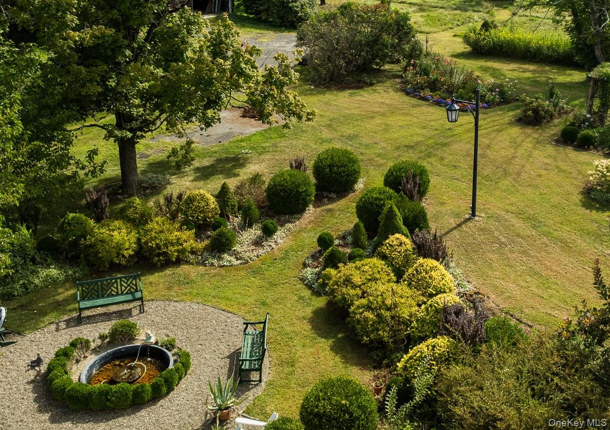1281 Woods Road Germantown, NY 12526 - Photo 5 of 33 a view of a garden with lawn chairs
