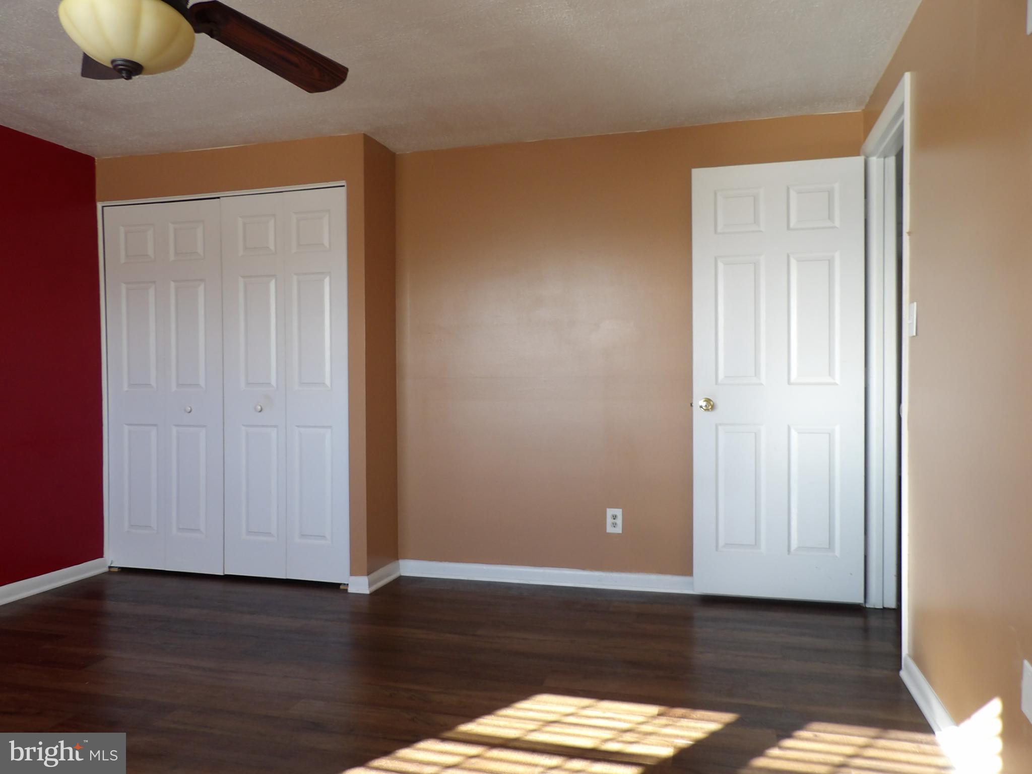 901 Grovehill Road Baltimore, MD 21227 - Photo 17 of 49 a view of an empty room and wooden floor