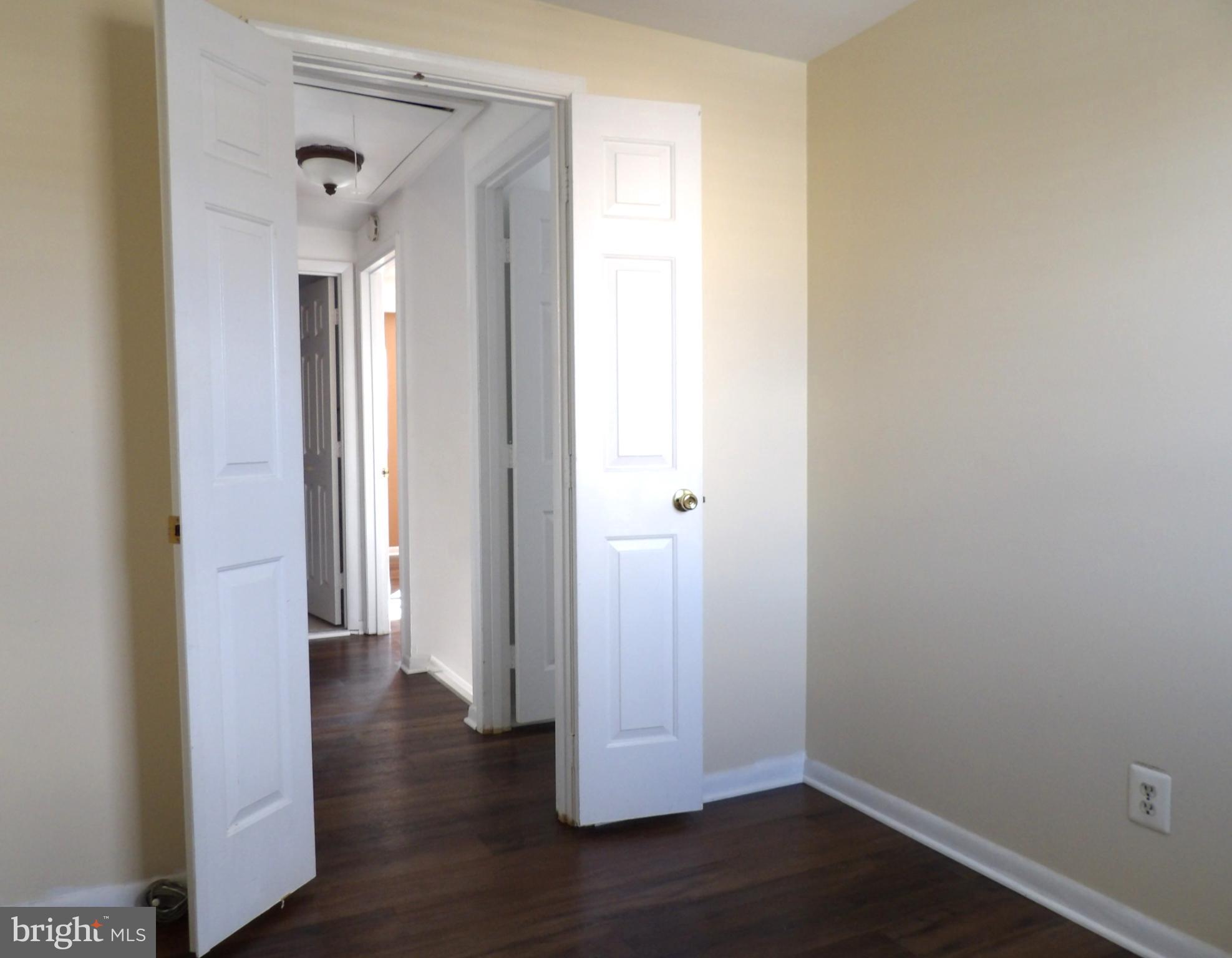 901 Grovehill Road Baltimore, MD 21227 - Photo 25 of 49 a view of a hallway with wooden floor