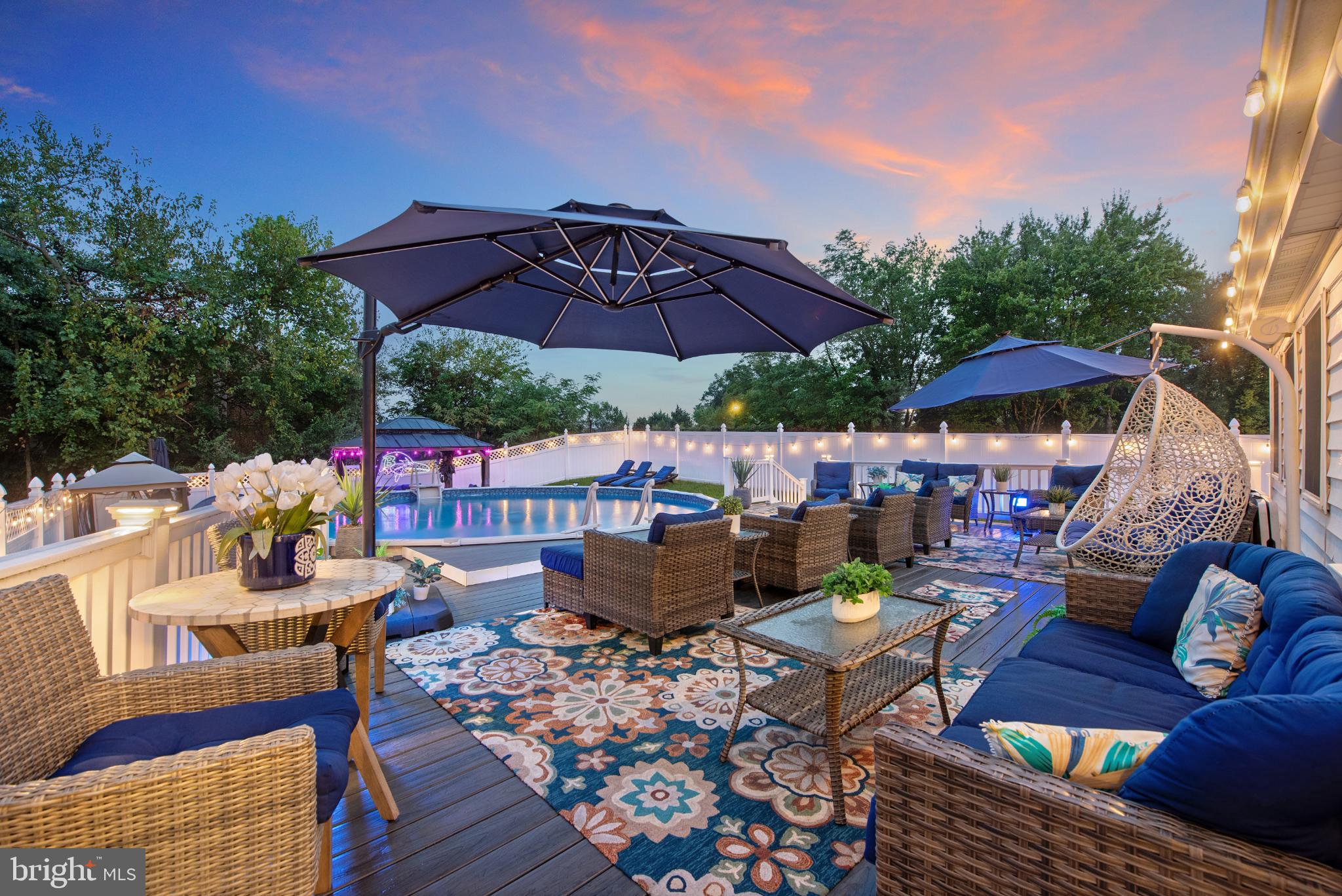 901 Grovehill Road Baltimore, MD 21227 - Photo 41 of 49 a view of a patio with furniture and a umbrella