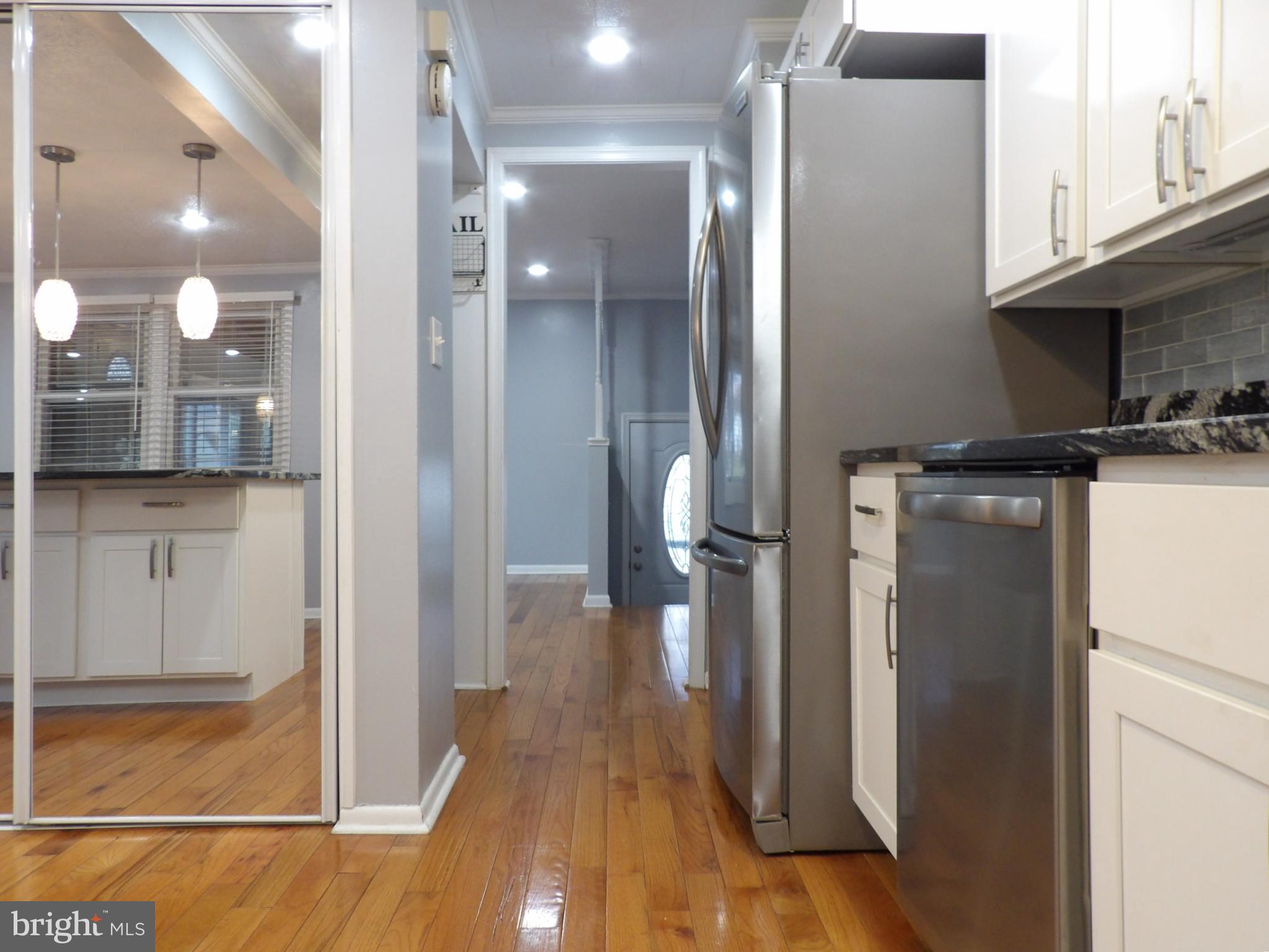 901 Grovehill Road Baltimore, MD 21227 - Photo 10 of 49 a view of a kitchen from the hallway