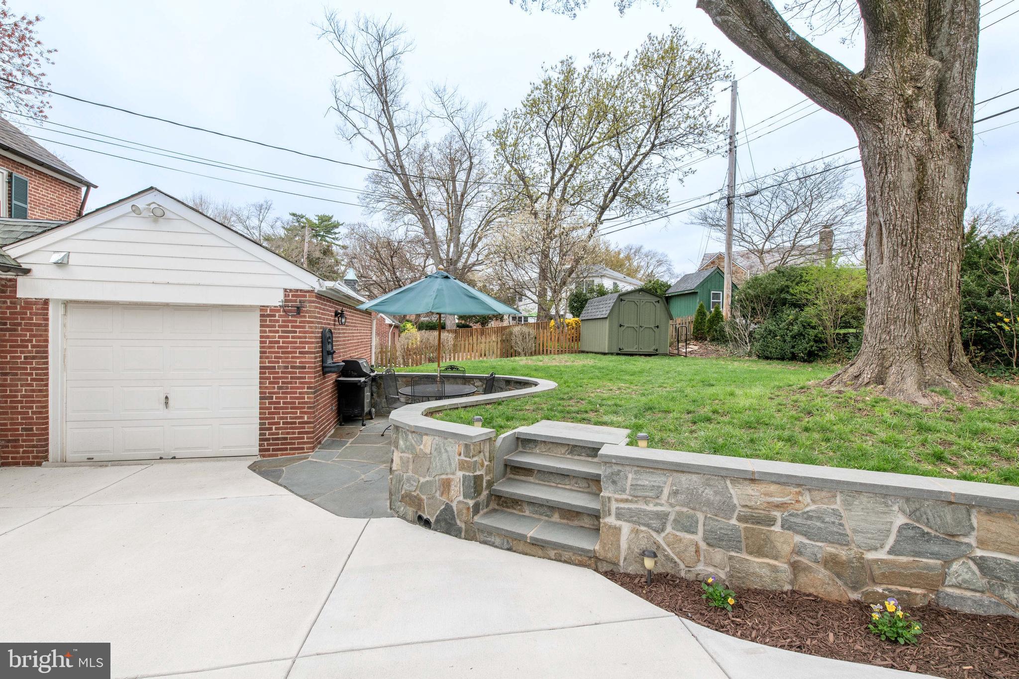 602 Worcester Road Towson, MD 21286 - Photo 32 of 41 a front view of a house with garden