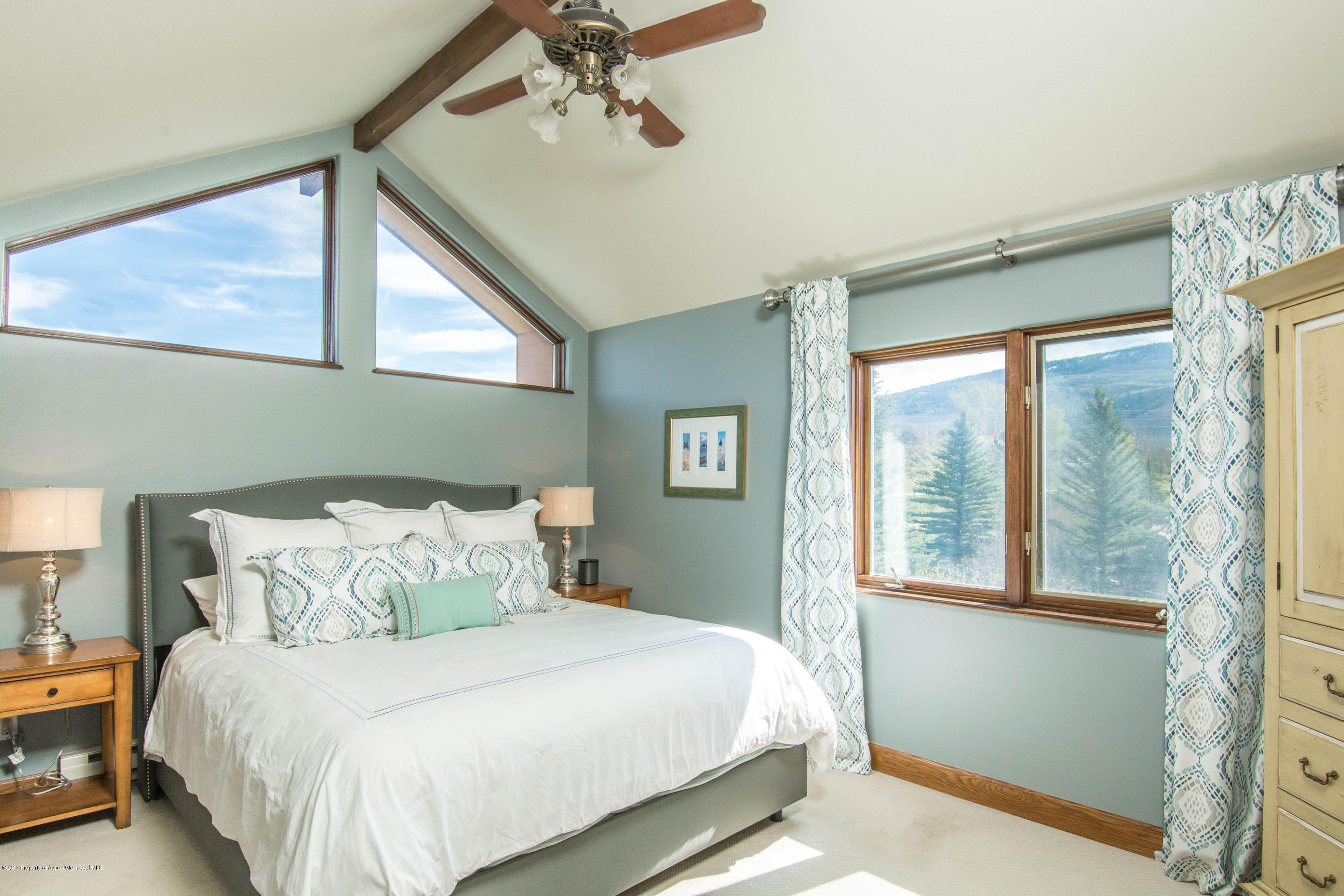 321 Mountain View Road Carbondale, CO 81623 - Photo 11 of 36 a bedroom with a large bed and a window