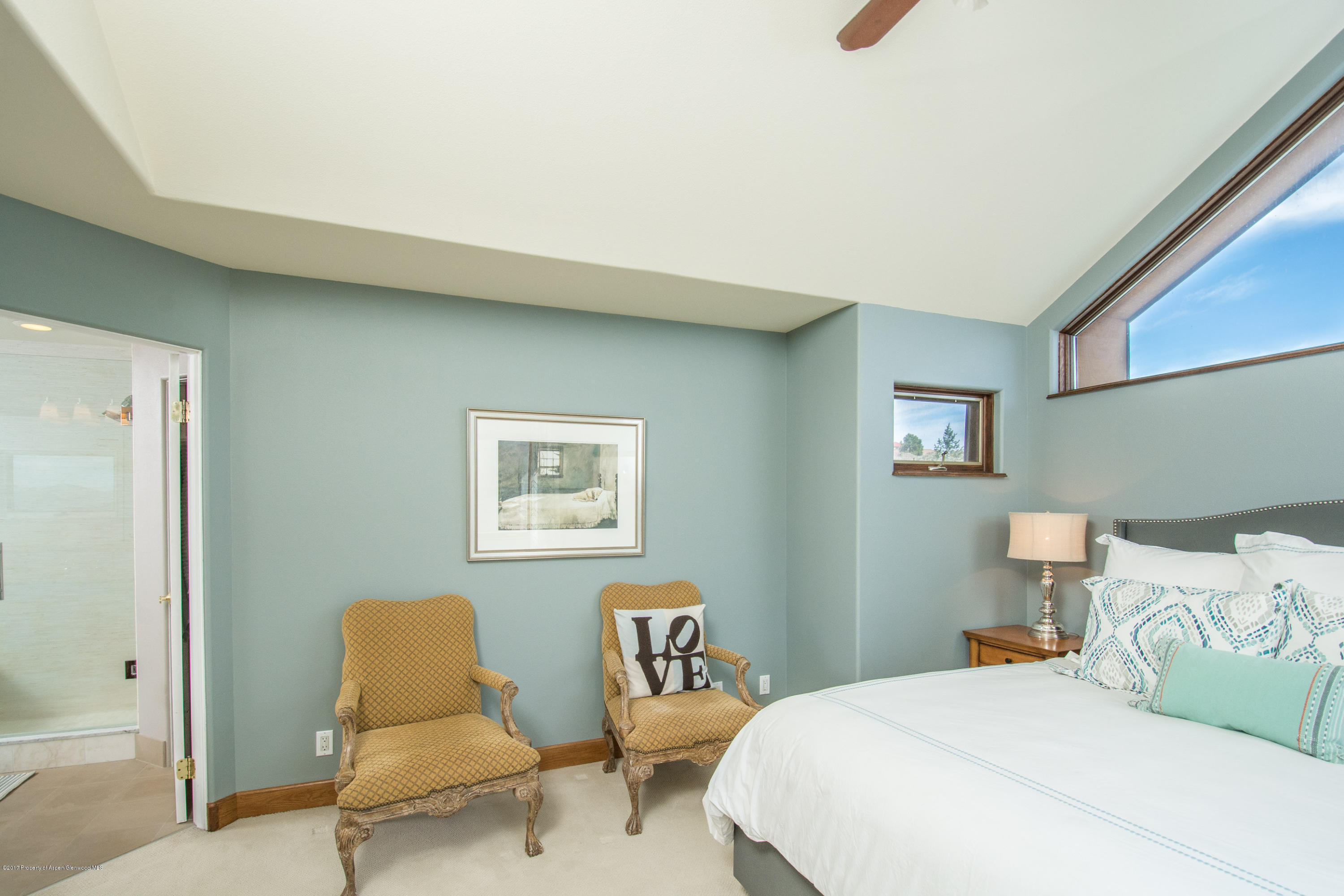 321 Mountain View Road Carbondale, CO 81623 - Photo 12 of 36 a bedroom with a bed and lamp