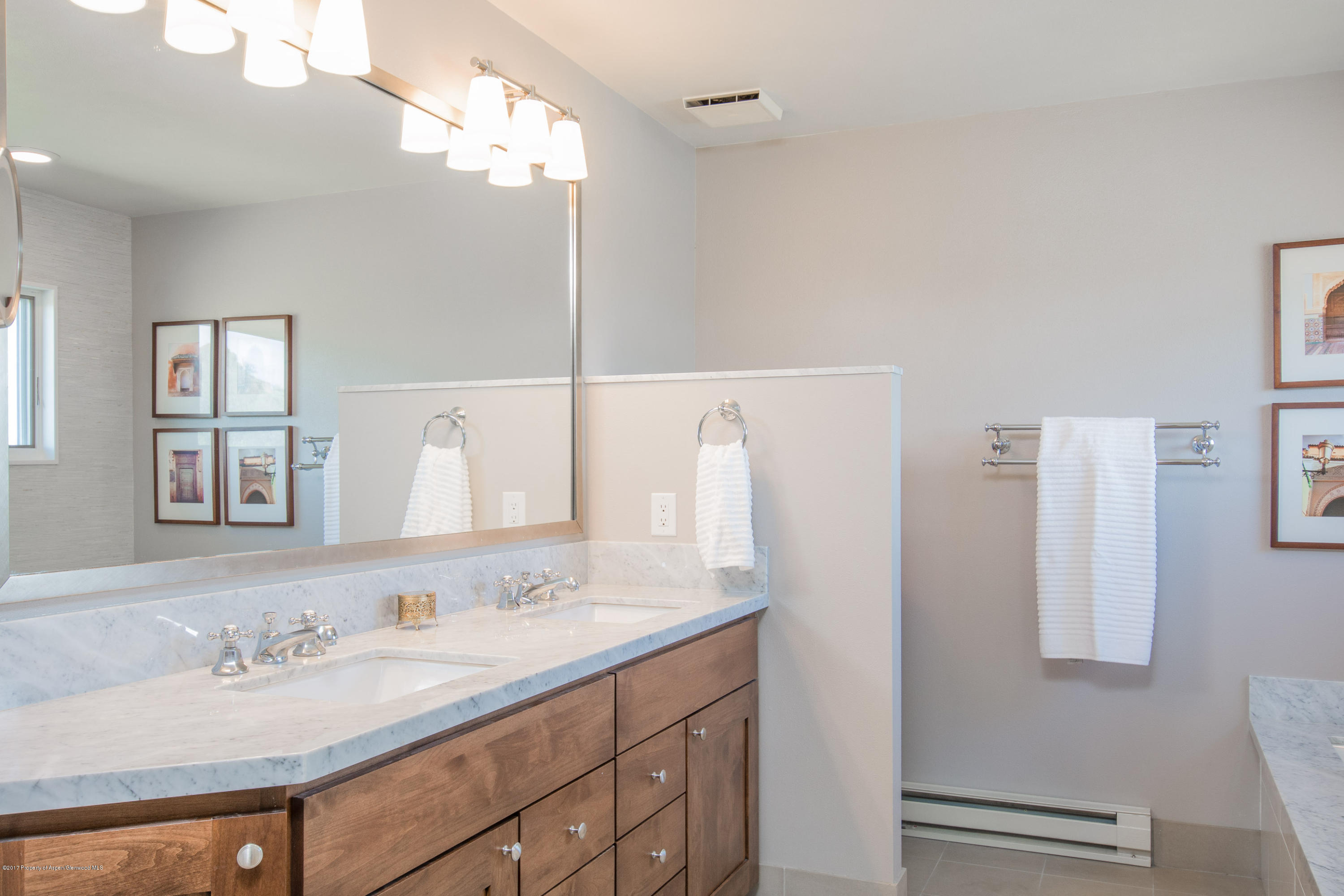 321 Mountain View Road Carbondale, CO 81623 - Photo 14 of 36 a bathroom with a double vanity sink and a mirror