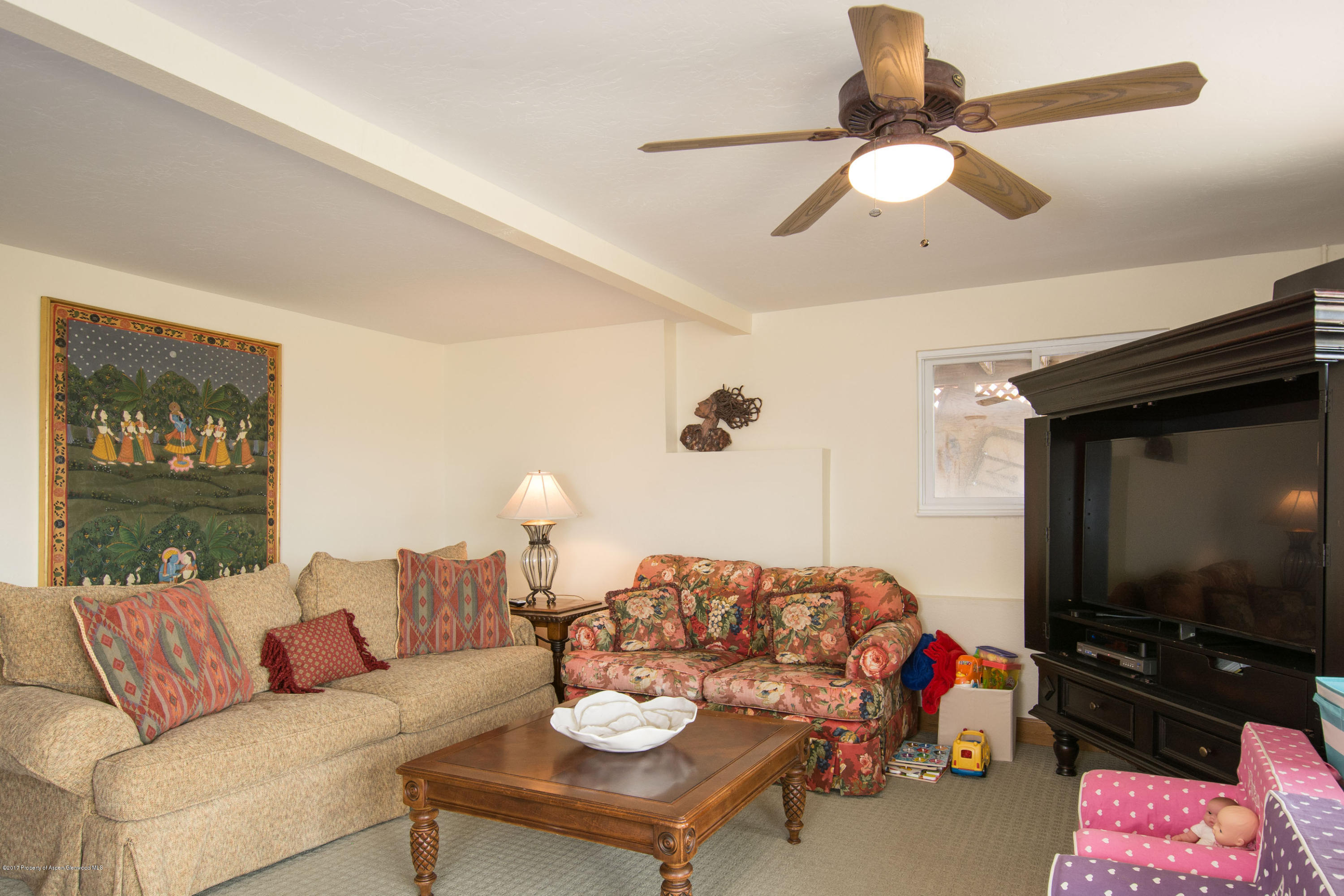 321 Mountain View Road Carbondale, CO 81623 - Photo 19 of 36 a living room with furniture a flat screen tv and a dining table