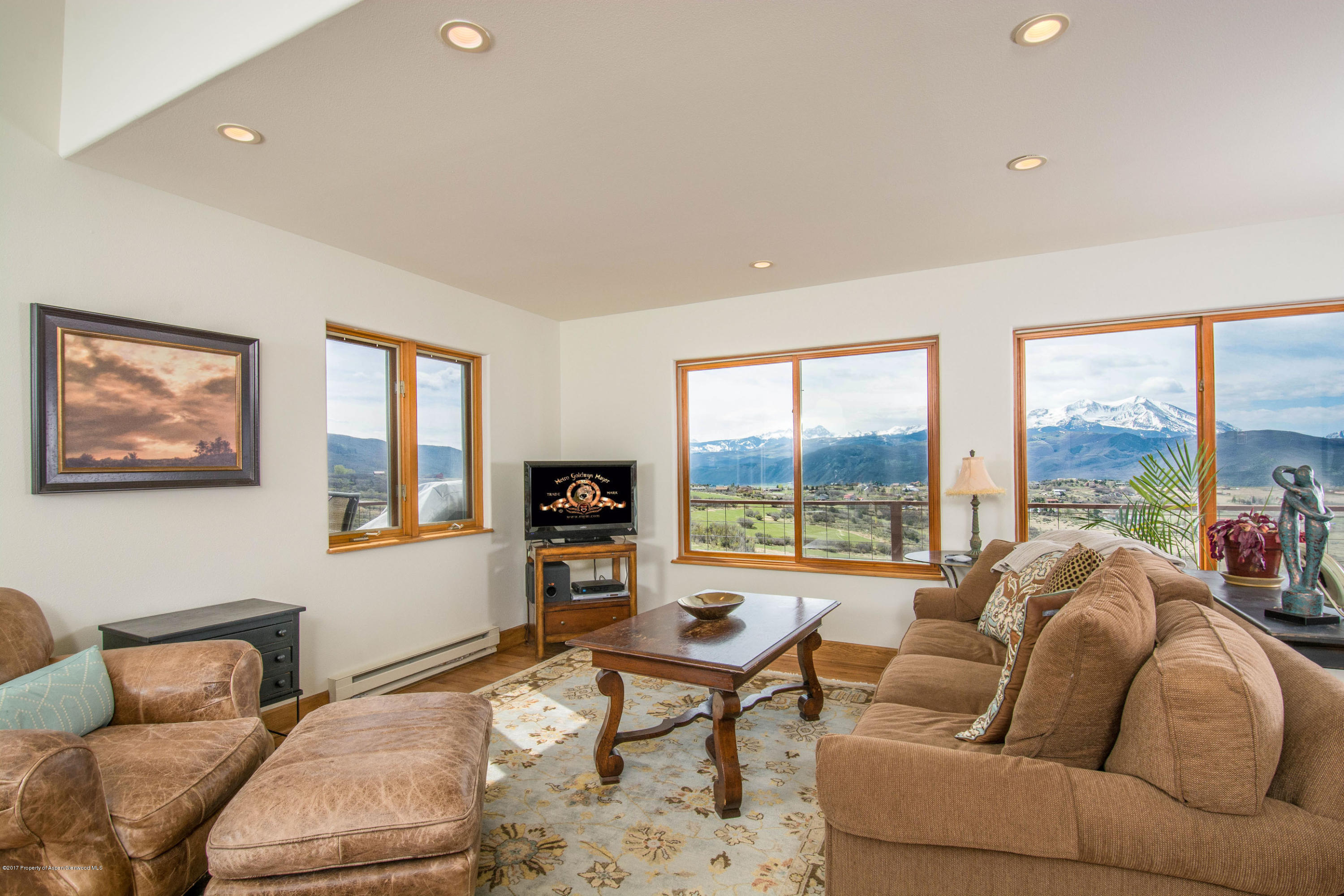 321 Mountain View Road Carbondale, CO 81623 - Photo 2 of 36 a living room with furniture and a floor to ceiling window