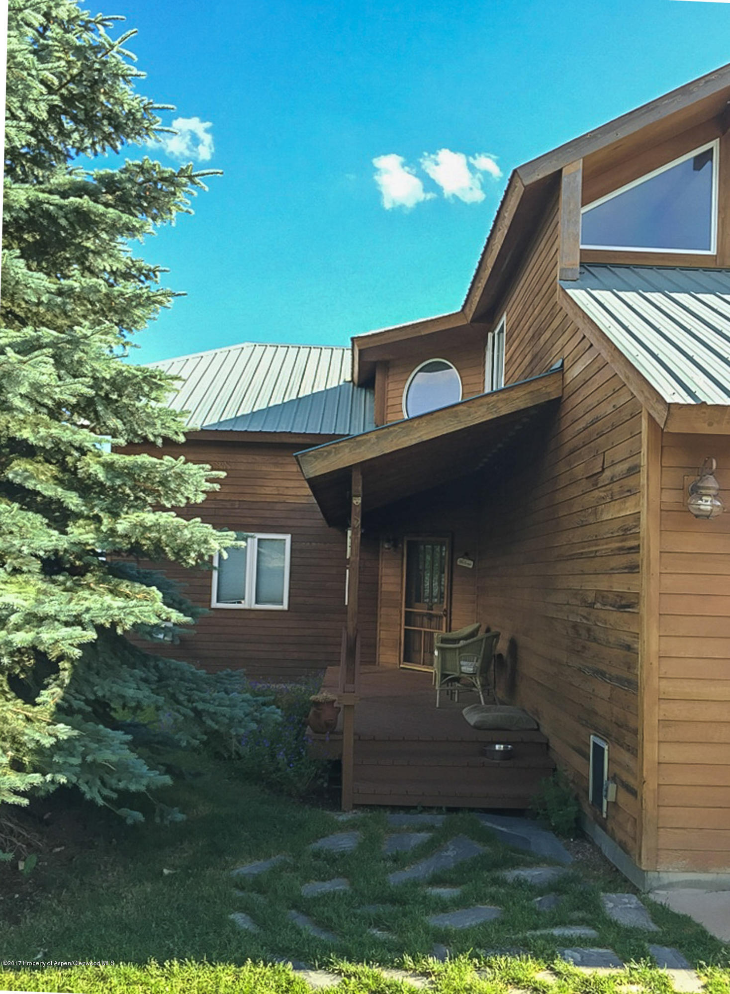 321 Mountain View Road Carbondale, CO 81623 - Photo 27 of 36 a front view of a house with garden